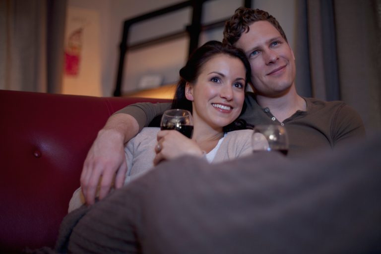 couple cuddling on couch